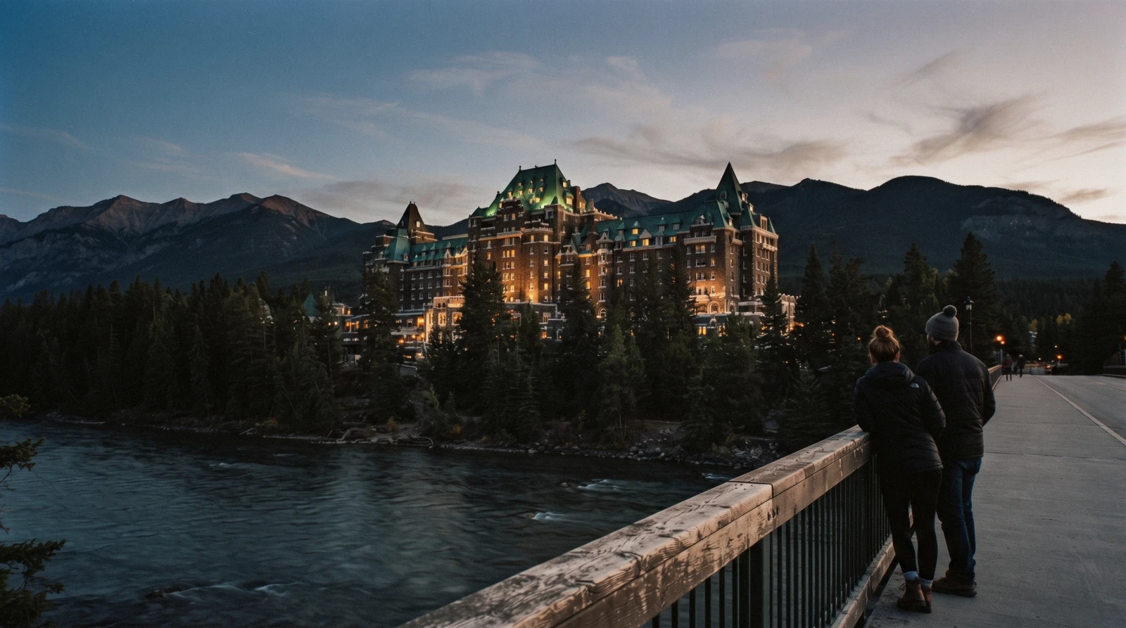 The Fairmont Banff Springs hotel towers above the Bow Valley with Mount Rundle behind it.